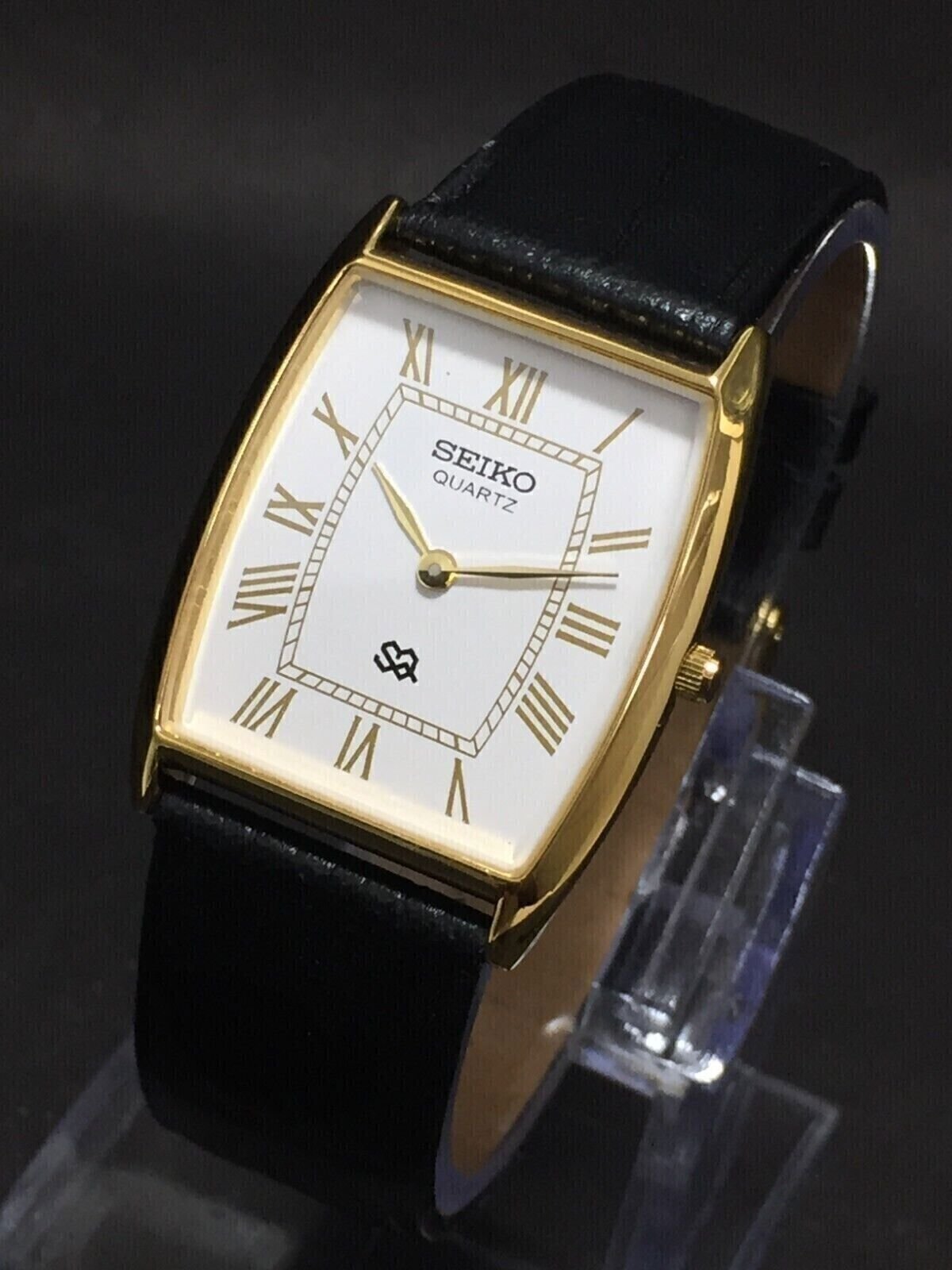 Seiko Slim Quartz White Face Black Band Men's Wrist Watch A44