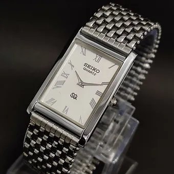 Seiko Slim Rectangular White Face Silver Band Mens watch A086