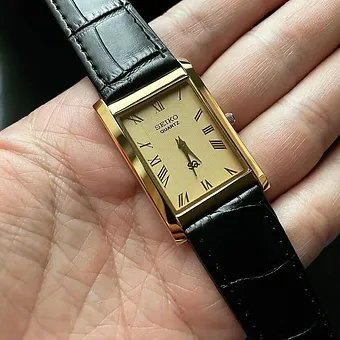 Seiko Slim Rectangular Gold Face Black Band Mens watch A0117