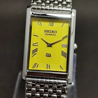 Seiko Slim Rectangular Yellow Face Silver Band Mens watch A0136